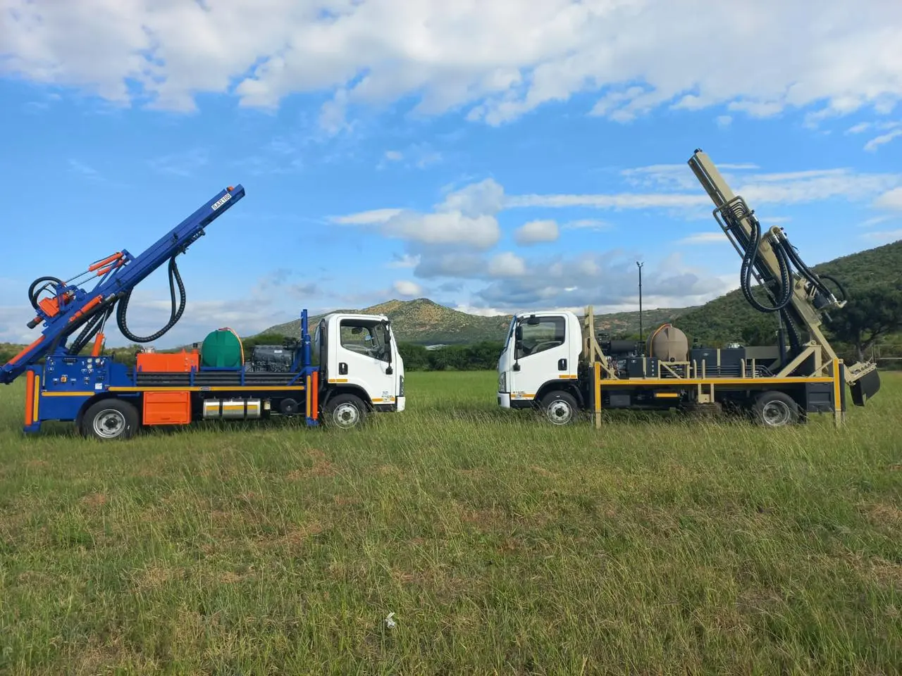 Truck-mounted SAR100 water well drill rig with compact mast operating in the field.