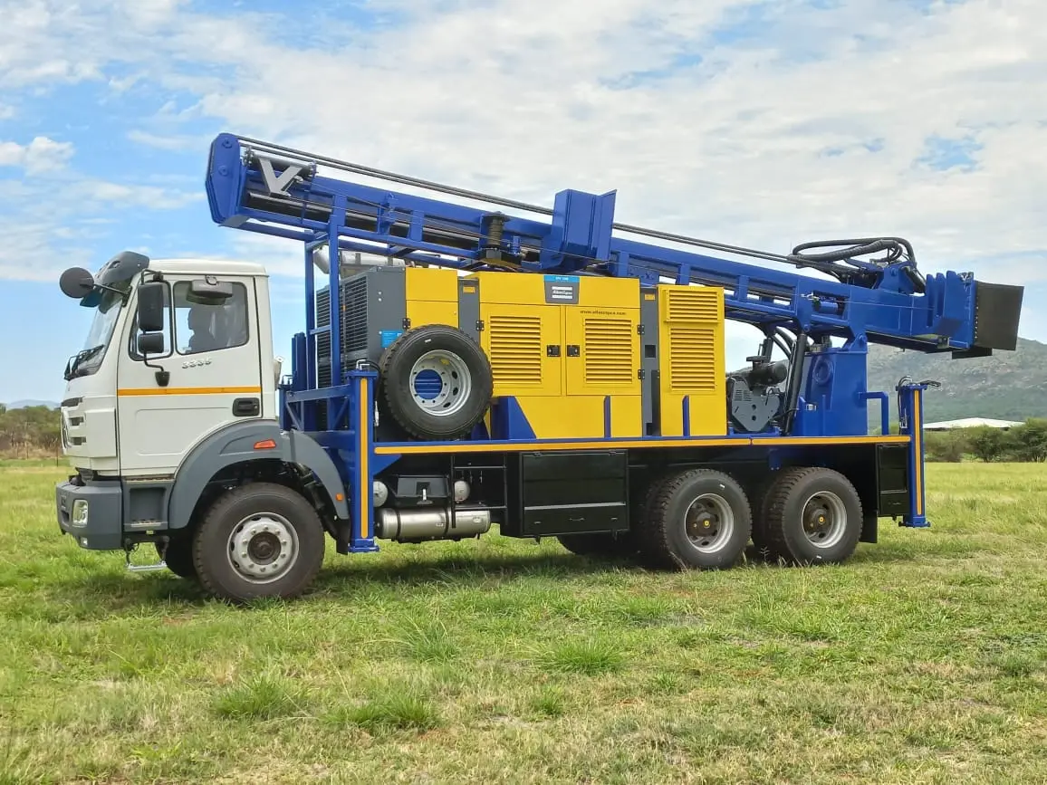 Heavy-duty SAR200 truck drill rig with 15-ton pullback and tall mast for deep well drilling.