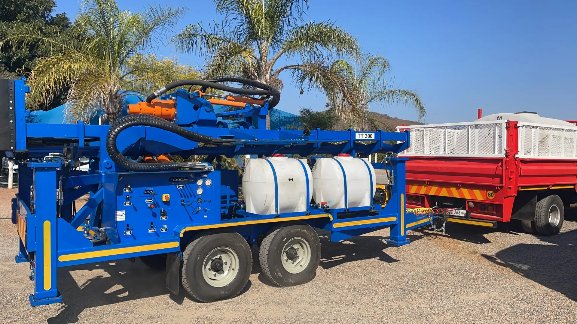 TT300 high-capacity trailer drill rig with tandem axle and 13-ton pullback system.