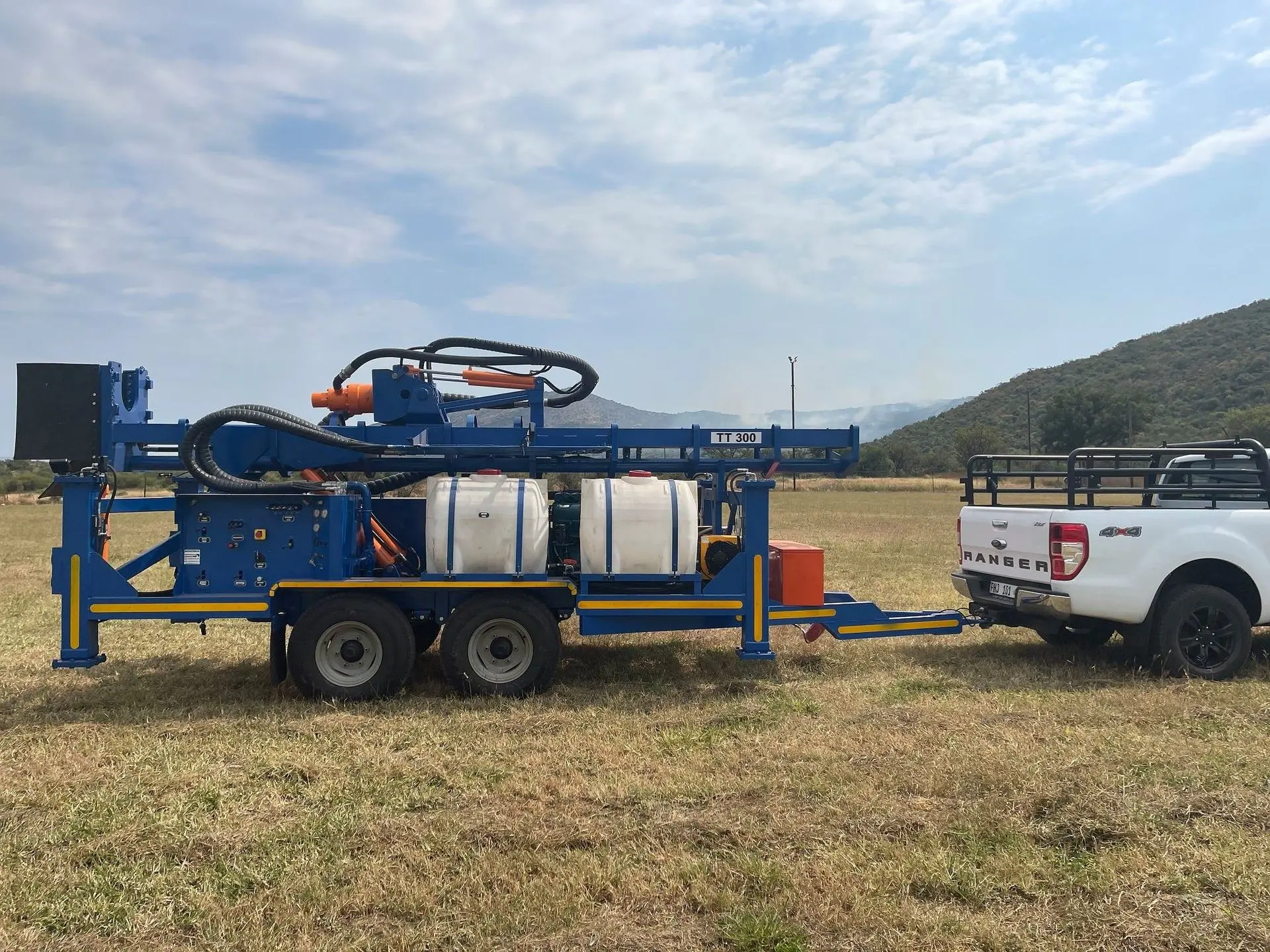 TT300 high-capacity trailer drill rig with tandem axle and 13-ton pullback system.