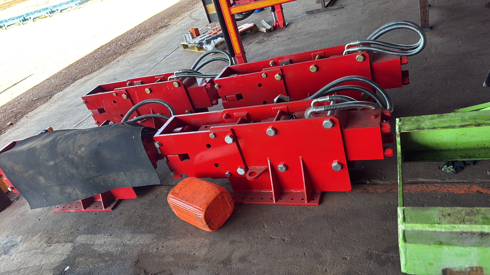 Power-head feed carriages stripped and repainted in Drillbuilders red with hoses re-run