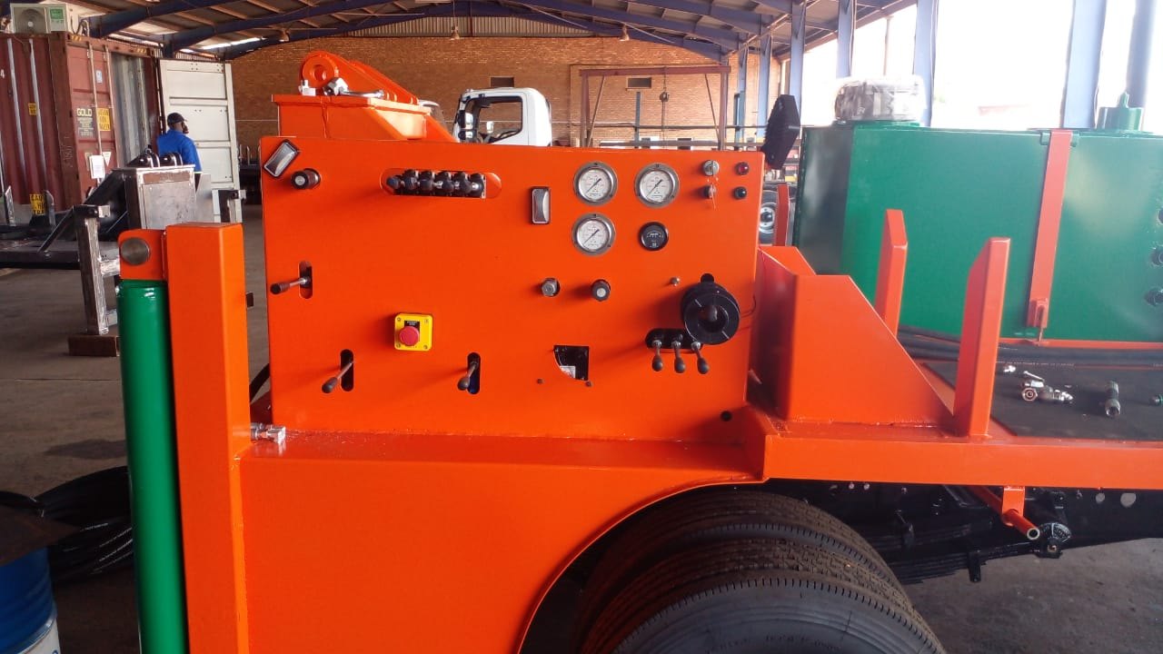 Freshly painted SAR100 control panel with hydraulic levers, pressure gauges and emergency stop, ready for testing