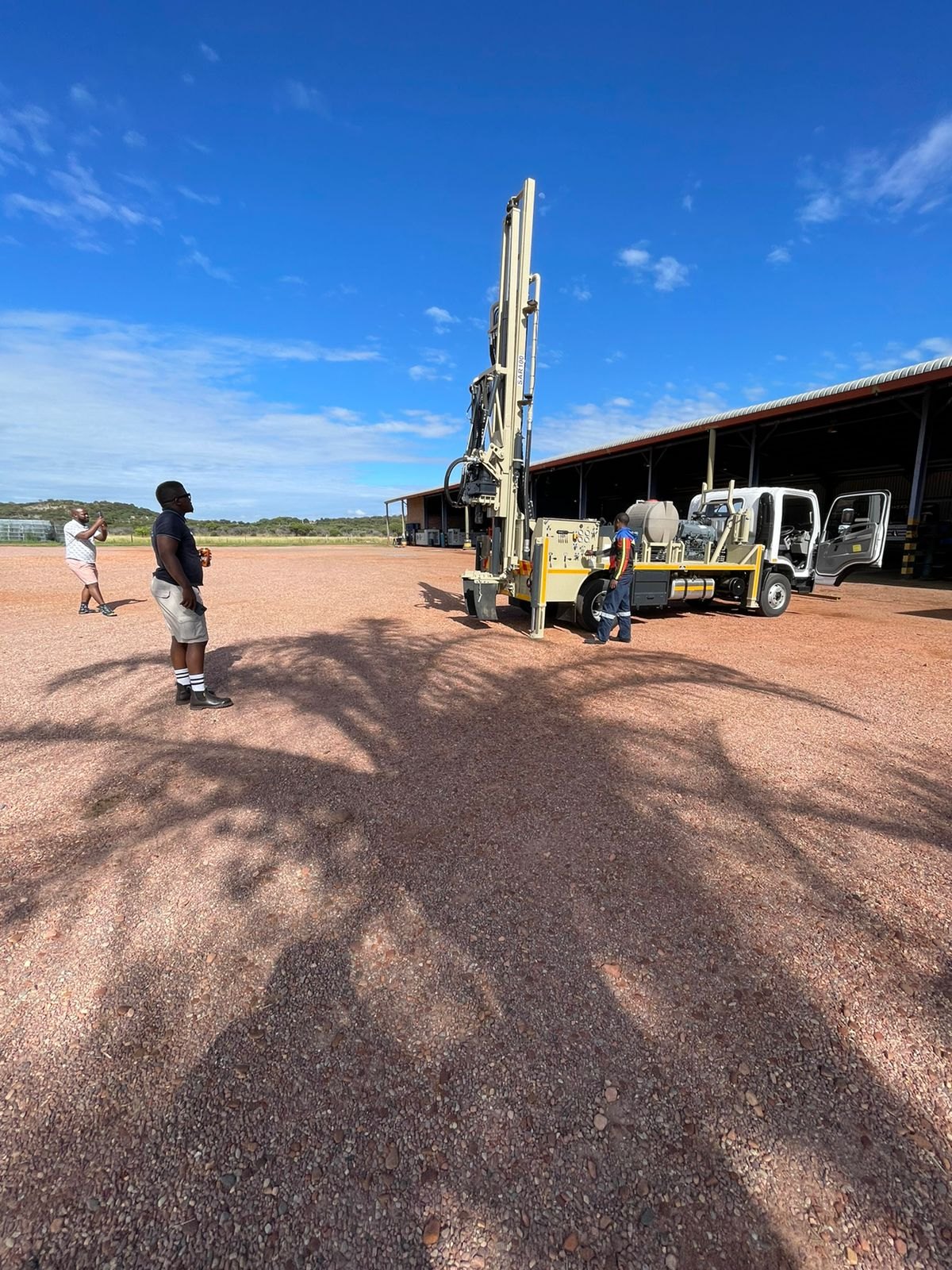Delivery day at the Drillbuilders factory: new owners stand back to photograph their SAR100 drilling rig