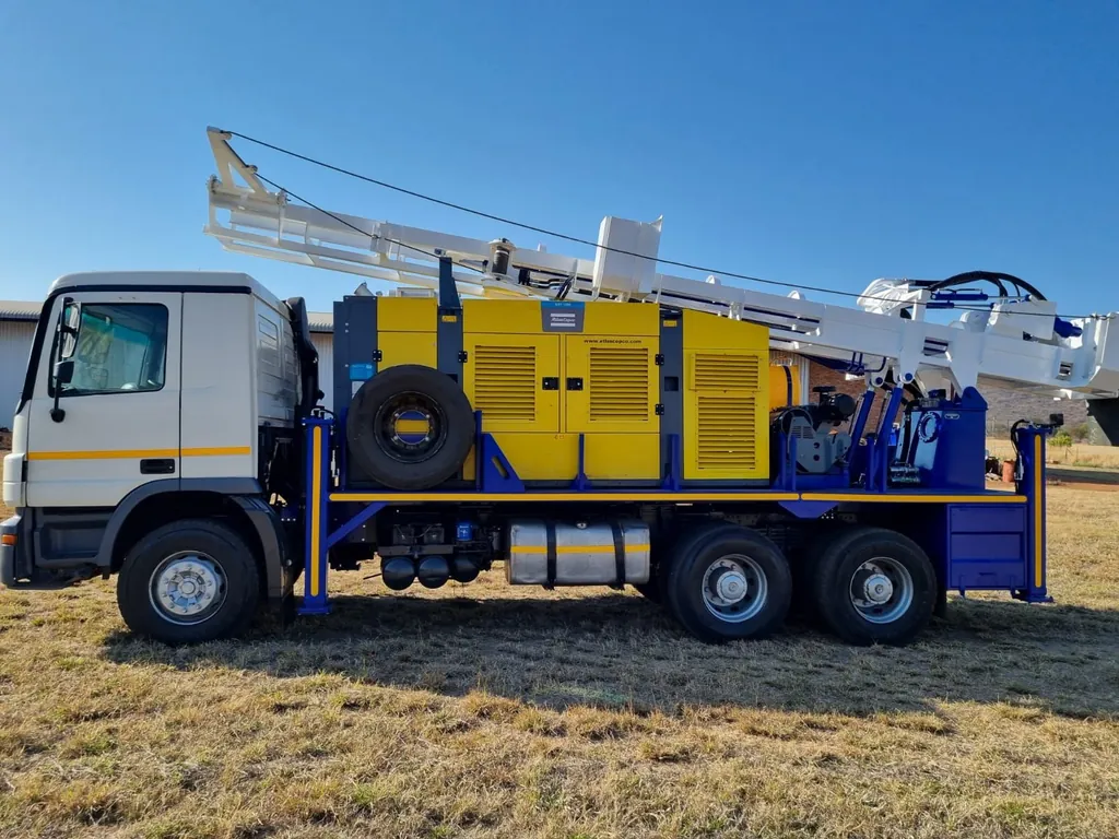 A200-5 drill rig showing its integrated compressor canopy and spare wheel on the truck deck